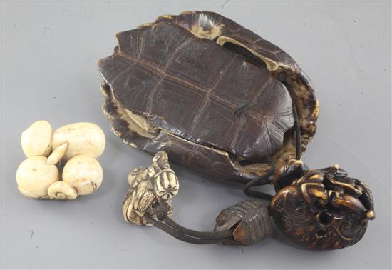 Two Japanese ivory netsuke and a turtle carapace pouch and netsuke, 19th century, carapace 10.7cm (3)